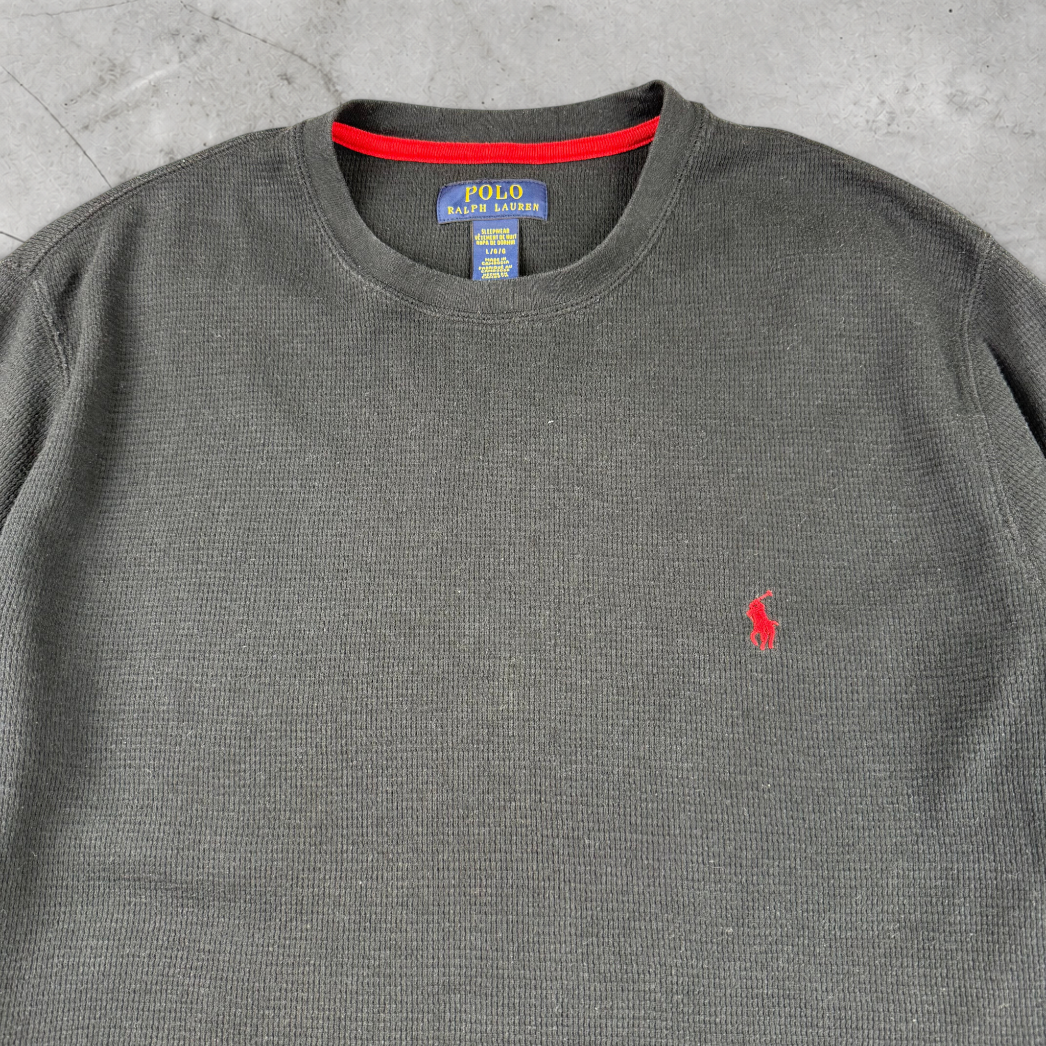 Wytek vintage black Polo Ralph Lauren waffle knit cotton sweatshirt with red embroidered logo and red neck trim.