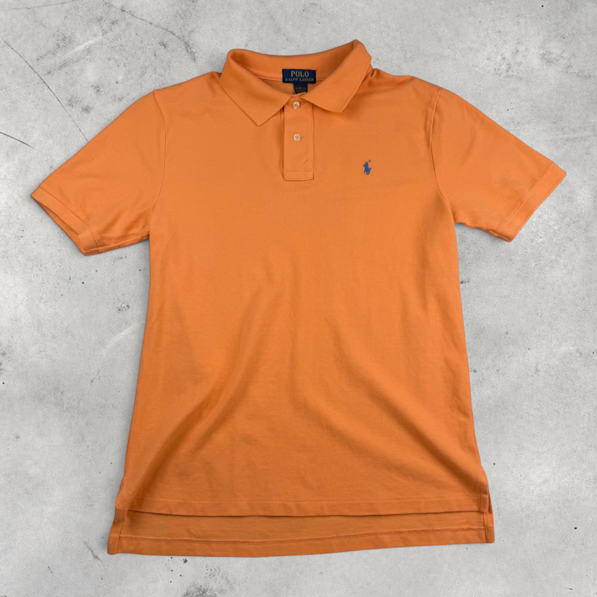Wytek vintage orange Ralph Lauren cotton polo shirt with navy blue embroidered logo on a grey background